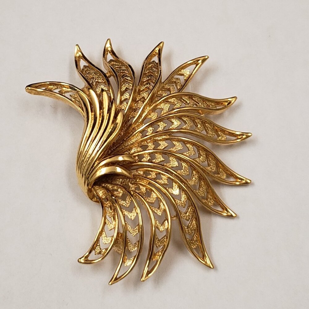 Monet, Vintage, signed large leafy open swirl gold tone brooch